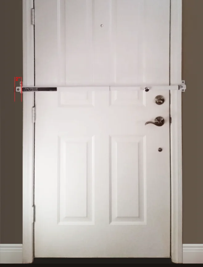 Armorbar fitted to a door